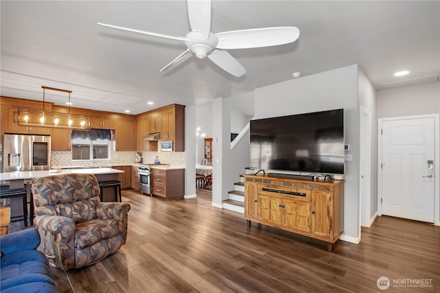11234 SE 299th Pl, Auburn, WA 98092 - living area with dark wood finished floors, ceiling fan, and recessed lighting
