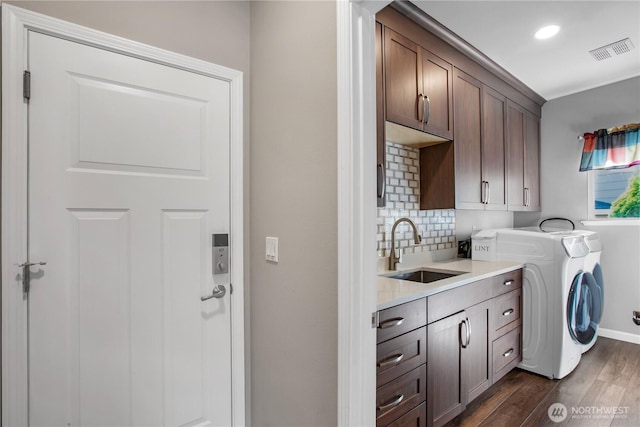 11234 SE 299th Pl, Auburn, WA 98092 - laundry room featuring visible vents, a sink, dark wood-type flooring, separate washer and dryer, and cabinet space
