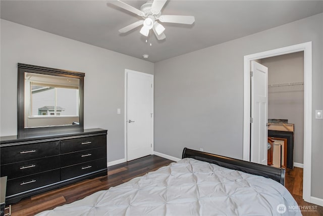 11234 SE 299th Pl, Auburn, WA 98092 - bedroom with a ceiling fan, a closet, baseboards, dark wood-type flooring, and a spacious closet