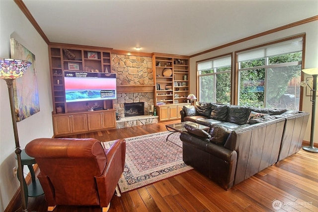 2116 263rd Pl SE, Sammamish, WA 98075 - living area with ornamental molding, a fireplace, hardwood / wood-style flooring, and built in shelves