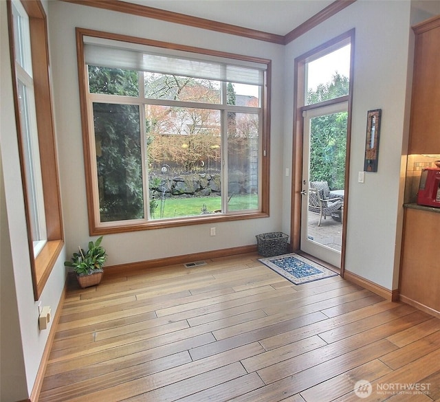 2116 263rd Pl SE, Sammamish, WA 98075 - interior space with crown molding, baseboards, visible vents, and light wood-type flooring