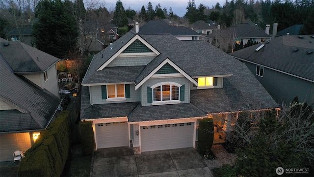 2116 263rd Pl SE, Sammamish, WA 98075 - view of front facade with roof with shingles, an attached garage, driveway, and a residential view