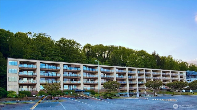 view of property featuring uncovered parking