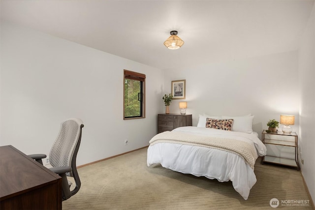 carpeted bedroom featuring baseboards