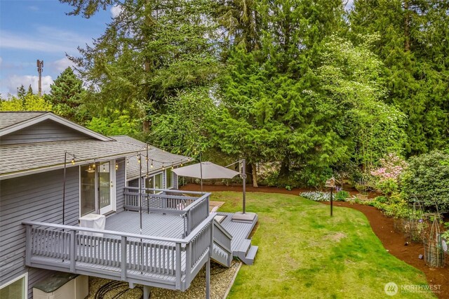 view of yard with a wooden deck