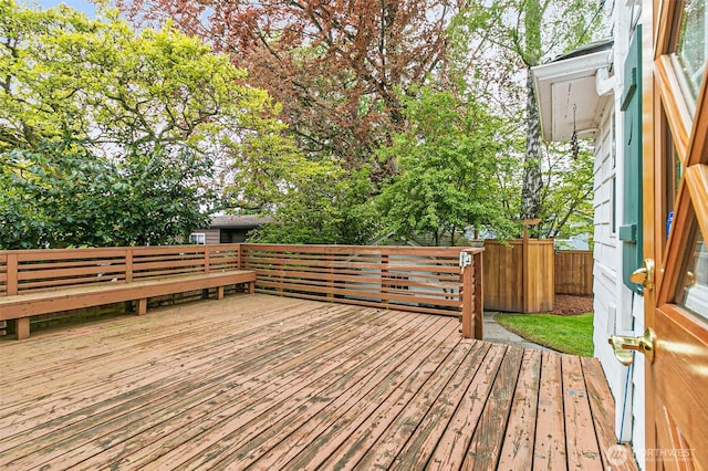 wooden deck featuring fence