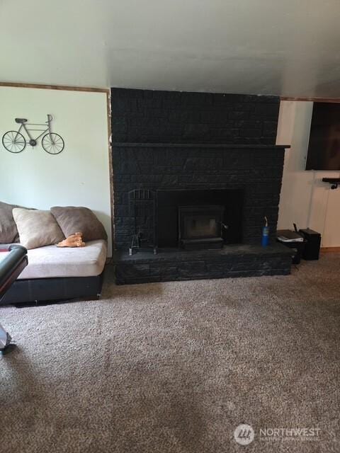 carpeted living room with a fireplace