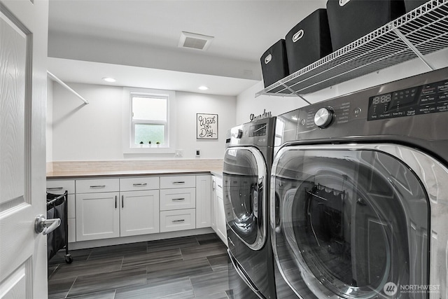 clothes washing area featuring visible vents, recessed lighting, cabinet space, and independent washer and dryer