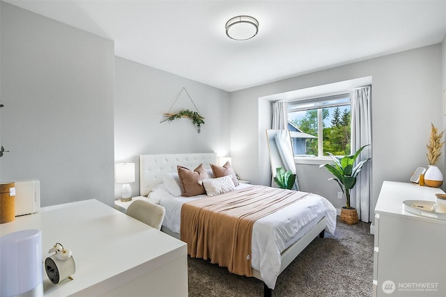 bedroom featuring dark colored carpet
