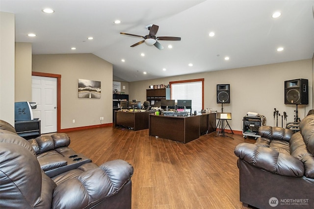 living area with ceiling fan, vaulted ceiling, baseboards, and wood finished floors