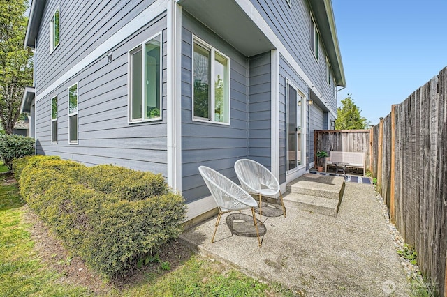 view of home's exterior featuring a fenced backyard and a patio area