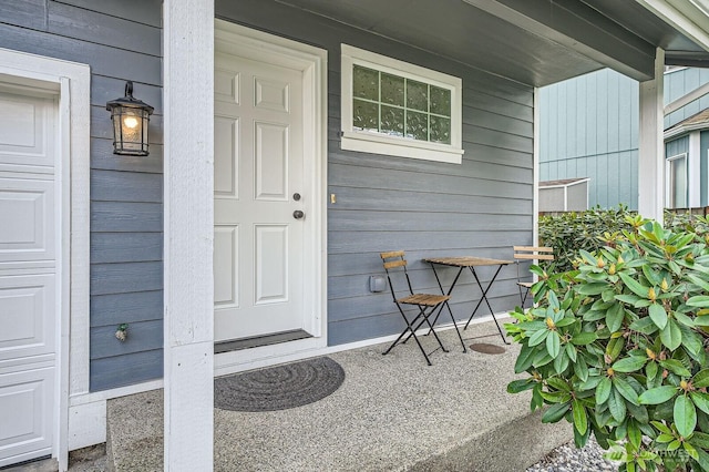 property entrance featuring covered porch