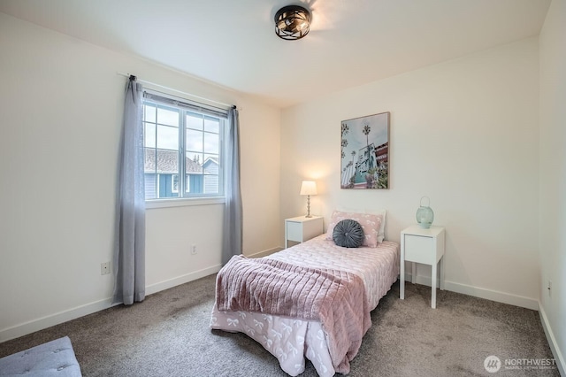 carpeted bedroom featuring baseboards
