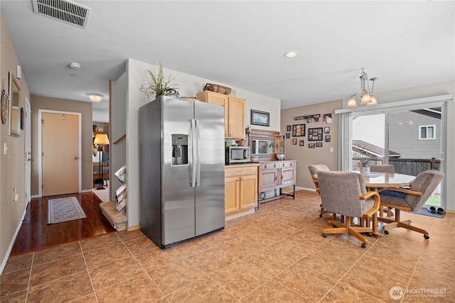 1810 Johnson Ave, Dupont, WA 98327 - kitchen featuring baseboards, appliances with stainless steel finishes, visible vents, and light brown cabinets