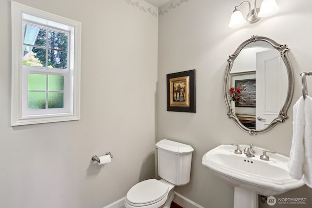 26712 151st St E, Buckley, WA 98321 - bathroom with a sink, toilet, and baseboards