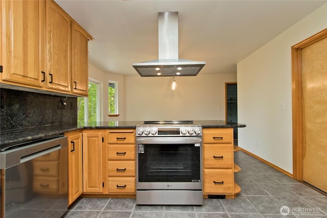 511 104th Ln SE, Olympia, WA 98501 - kitchen with stainless steel appliances, island range hood, a peninsula, backsplash, and tile patterned floors