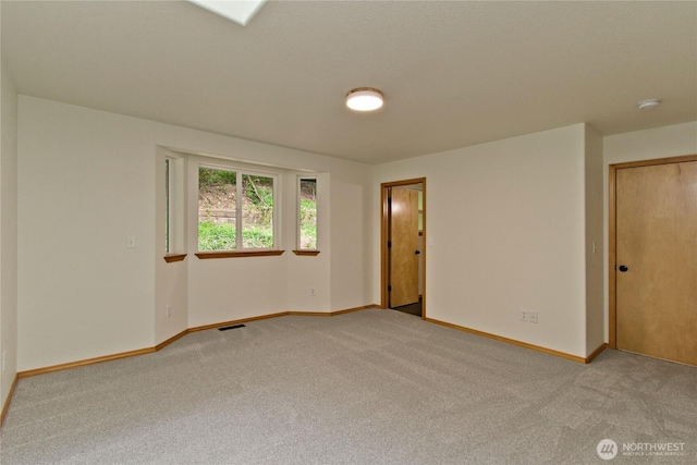 511 104th Ln SE, Olympia, WA 98501 - spare room with light colored carpet, baseboards, and a smoke detector