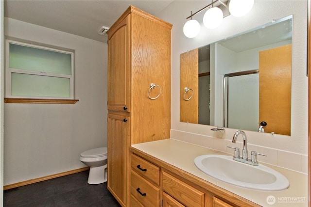 511 104th Ln SE, Olympia, WA 98501 - bathroom featuring toilet, a stall shower, and vanity