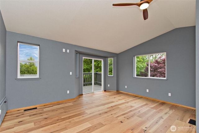 511 104th Ln SE, Olympia, WA 98501 - spare room with light wood-style floors, ceiling fan, healthy amount of natural light, and vaulted ceiling