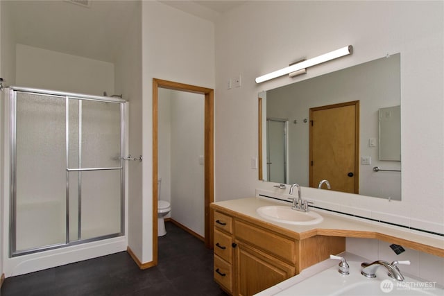 511 104th Ln SE, Olympia, WA 98501 - bathroom with a shower stall, toilet, and vanity