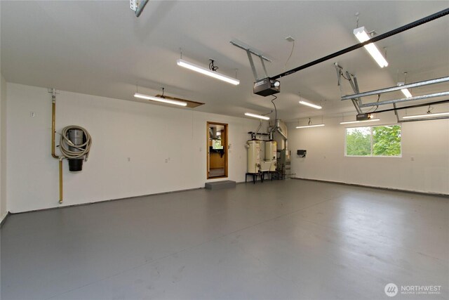 511 104th Ln SE, Olympia, WA 98501 - garage with gas water heater and a garage door opener
