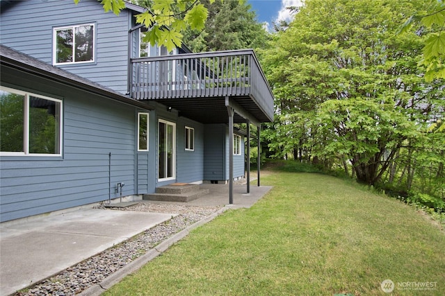 511 104th Ln SE, Olympia, WA 98501 - view of grassy yard featuring a patio and a deck