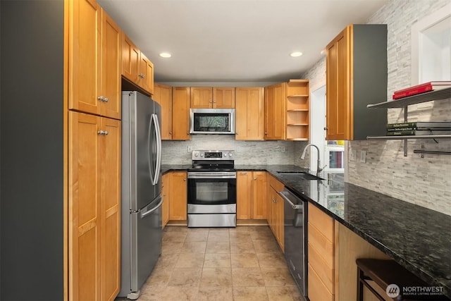 6369 23rd Ave SW, Seattle, WA 98106 - kitchen featuring open shelves, tasteful backsplash, a sink, dark stone countertops, and appliances with stainless steel finishes