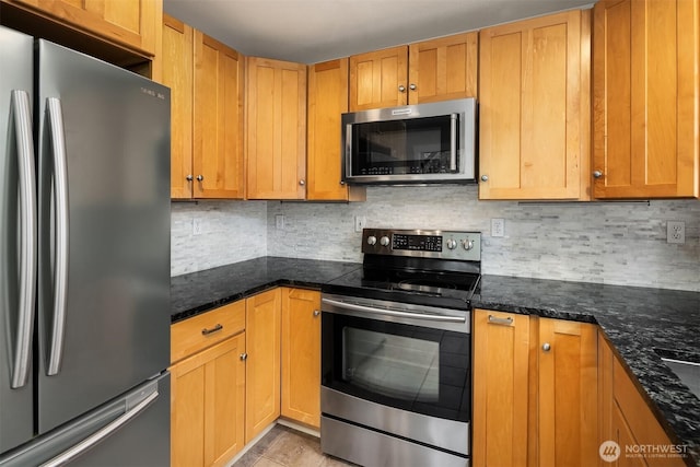 6369 23rd Ave SW, Seattle, WA 98106 - kitchen with decorative backsplash, dark stone countertops, and stainless steel appliances