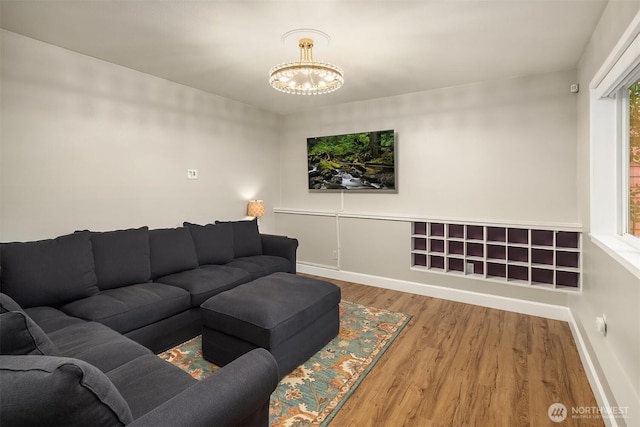 6369 23rd Ave SW, Seattle, WA 98106 - living room featuring baseboards, a notable chandelier, and wood finished floors