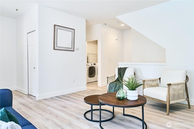 12310 NE 92nd St Unit H202, Kirkland, WA 98033 - sitting room with baseboards, recessed lighting, light wood finished floors, and washing machine and clothes dryer