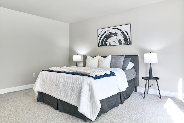 carpeted bedroom with baseboards