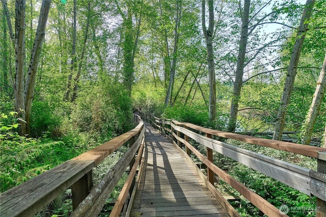 view of property's community featuring a wooded view