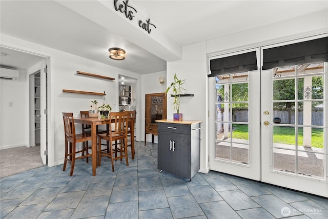 5808 241st St SW, Mountlake Terrace, WA 98036 - dining area featuring an AC wall unit, baseboards, and french doors