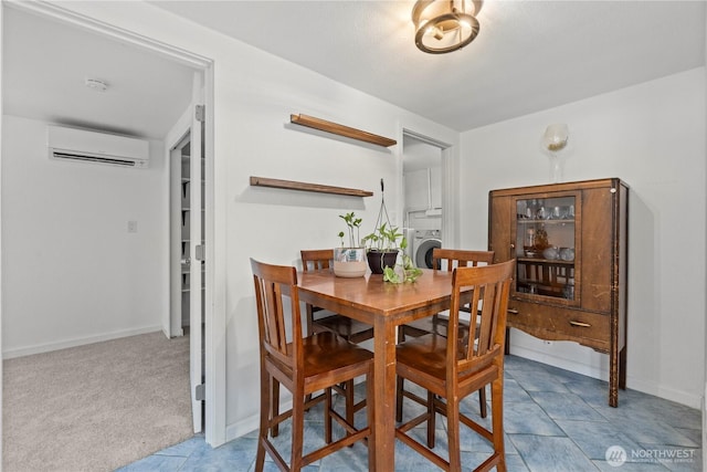 5808 241st St SW, Mountlake Terrace, WA 98036 - carpeted dining room featuring baseboards, an AC wall unit, tile patterned floors, and washer / clothes dryer