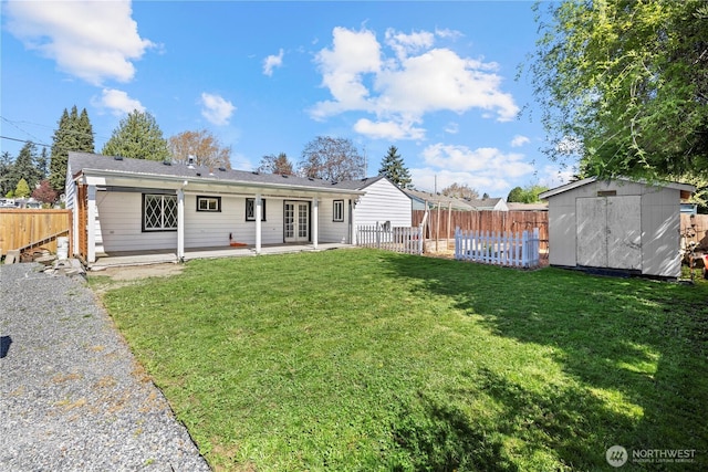 5808 241st St SW, Mountlake Terrace, WA 98036 - back of property featuring french doors, a patio, a lawn, and a storage shed