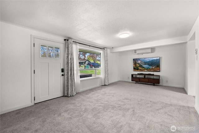 5808 241st St SW, Mountlake Terrace, WA 98036 - unfurnished living room with carpet flooring, a textured ceiling, a wall unit AC, and baseboards