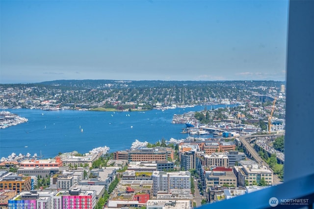 view of urban area with a large body of water