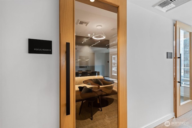hallway featuring baseboards
