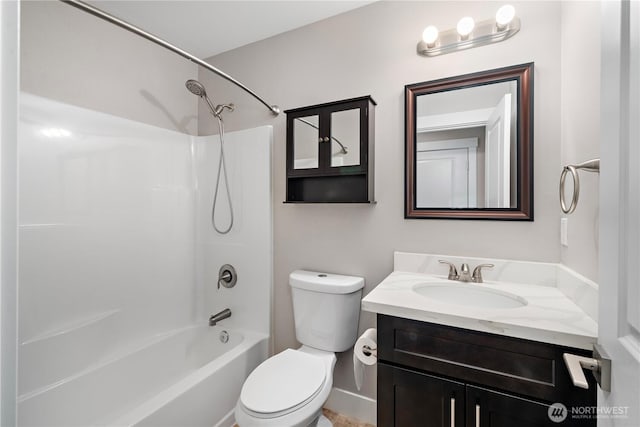 bathroom with vanity, toilet, and washtub / shower combination