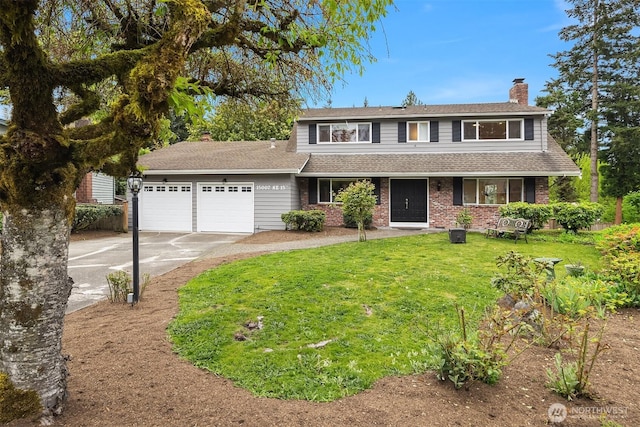 traditional-style house featuring driveway, a chimney, a front yard, brick siding, and an attached garage