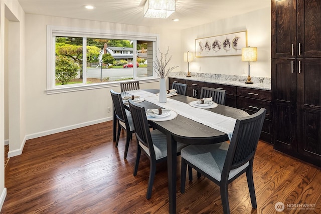 dining area featuring recessed lighting, baseboards, dark wood-style floors, and a chandelier