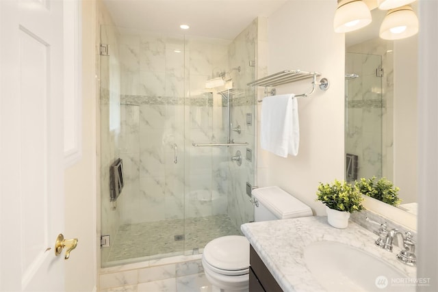 bathroom with vanity, toilet, a marble finish shower, and marble finish floor