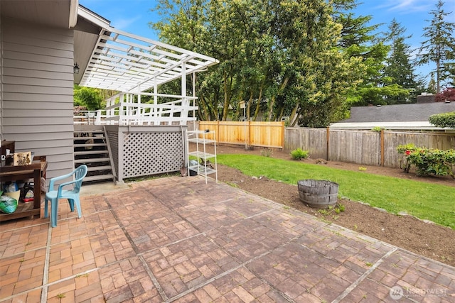 view of patio / terrace featuring a fenced backyard, a pergola, and stairway