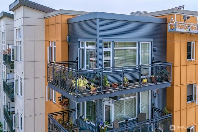 back of property featuring a balcony