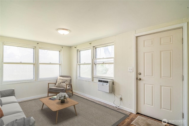 living area featuring dark wood-type flooring and baseboards