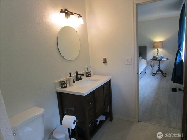 ensuite bathroom with toilet and vanity