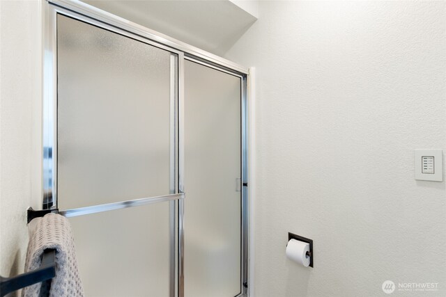 bathroom with an enclosed shower