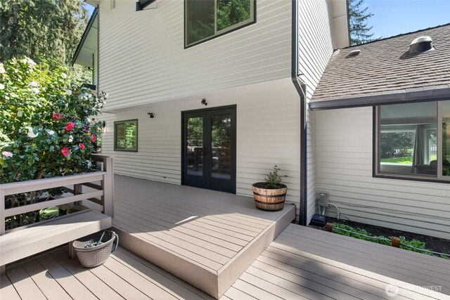 wooden deck featuring french doors