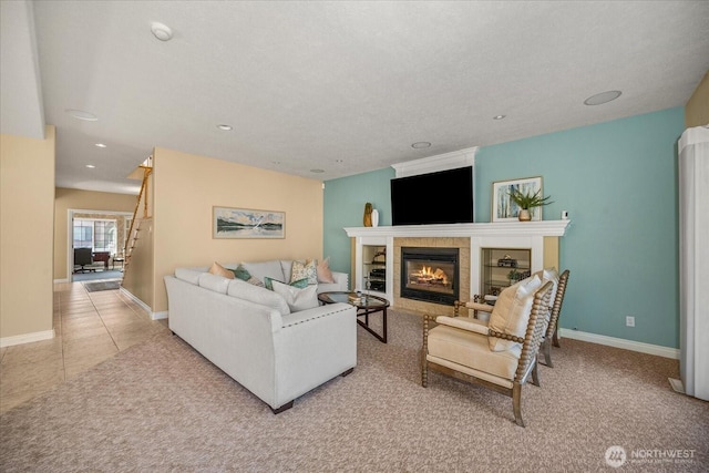 1909 E Pinecrest Rd, Spokane, WA 99202 - living area with a fireplace, recessed lighting, stairs, baseboards, and tile patterned flooring