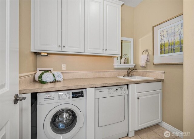 1909 E Pinecrest Rd, Spokane, WA 99202 - laundry area with washing machine and dryer, light tile patterned floors, and cabinet space